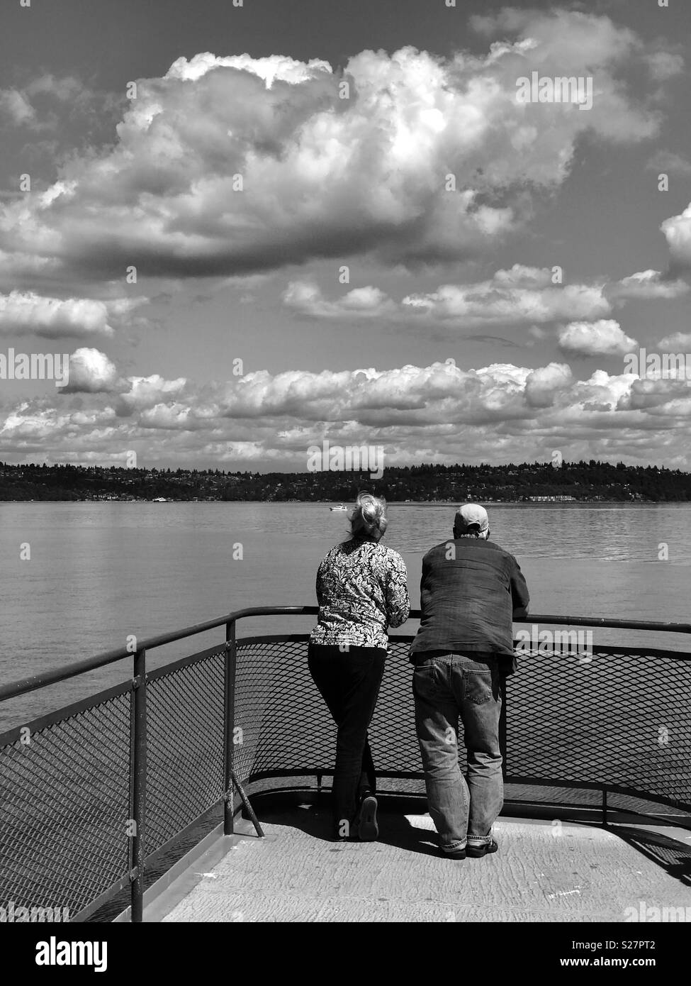 Couple on deck of Puget Sound Ferry, Seattle, Washington - July - Black and White Stock Photo