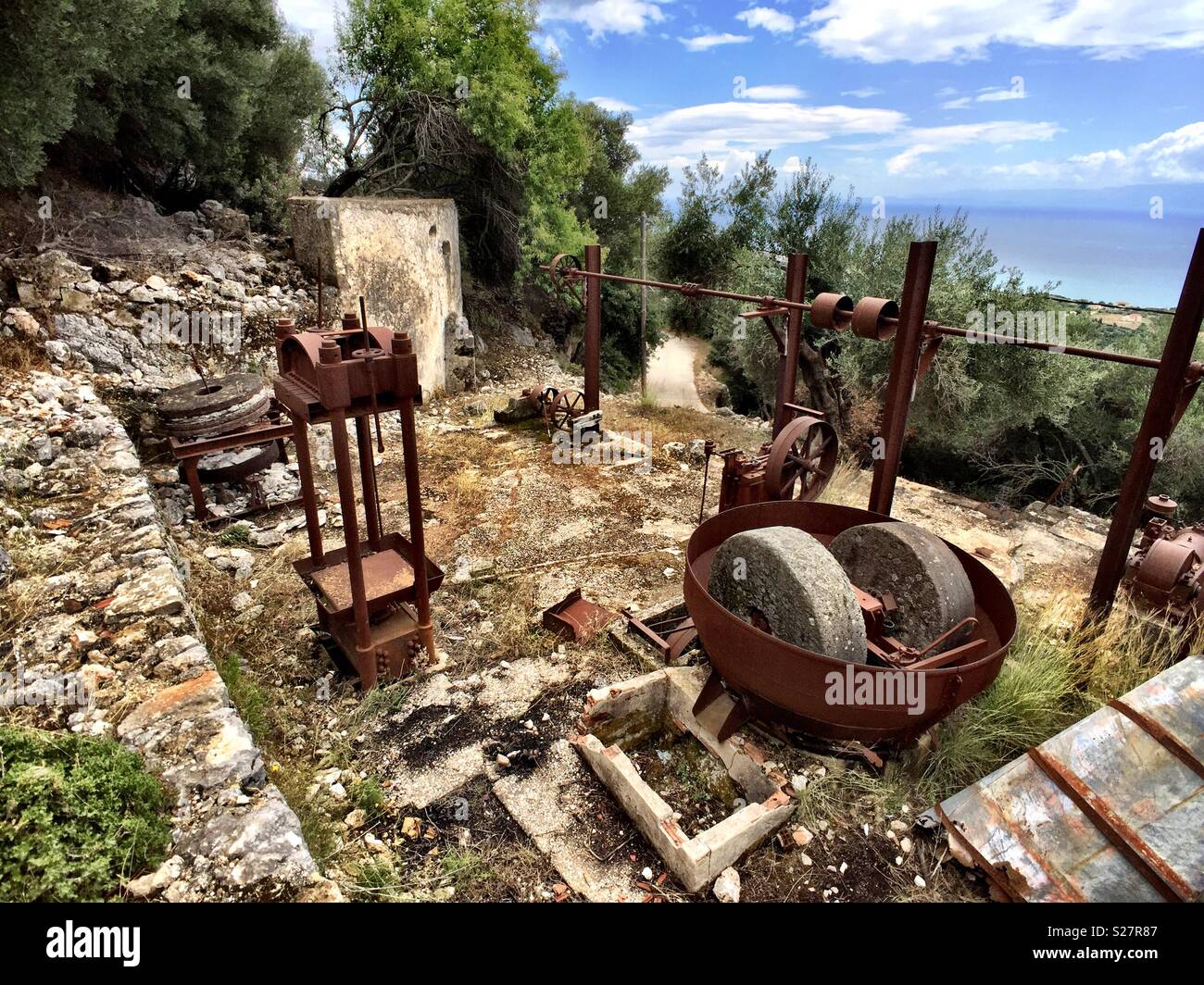 Old Skala abandoned village in Kefalonia Greece. Village was abandoned following earthquake in 1953. This was clearly a building housing machinery driven by a Diesel engine - Smartphone Captured Stock Image