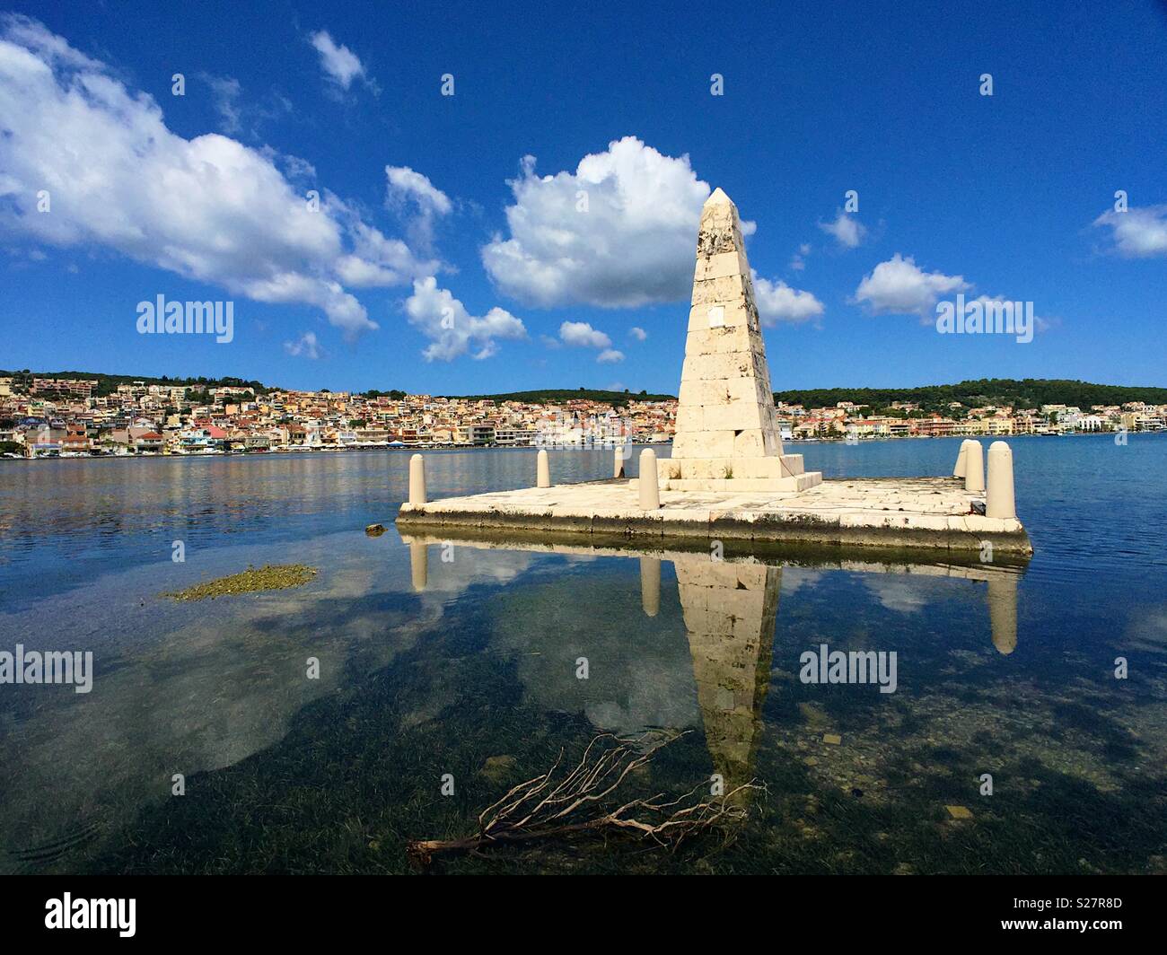 View of Argostoli Kefalonia from the Drepano bridge showing a stone column built by the British to celebrate their presence - Smartphone Captured Stock Image