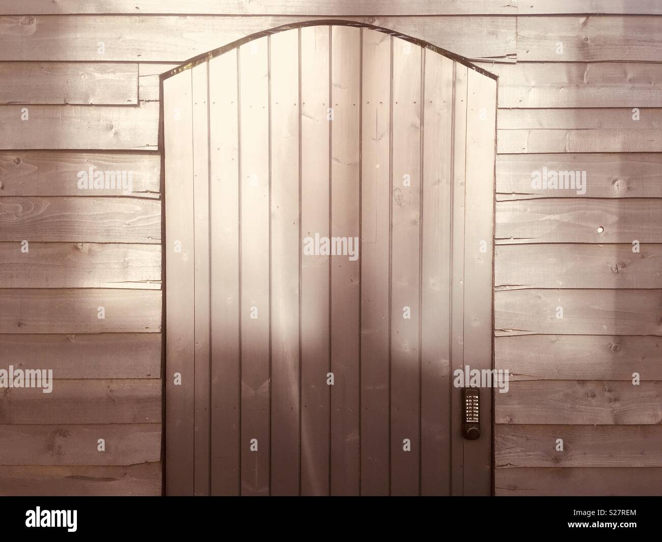 Wooden door with alphanumeric keypad entry, on Kipling Street