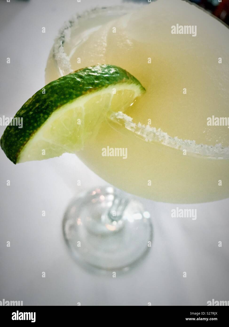 Frozen margarita with salted rim and lime slice, USA Stock Photo
