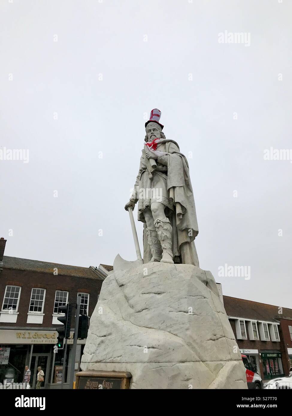 The statue of King Alfred in Wantage, Oxfordshire is draped with England colours for the World Cup in 2018. Stock Photo