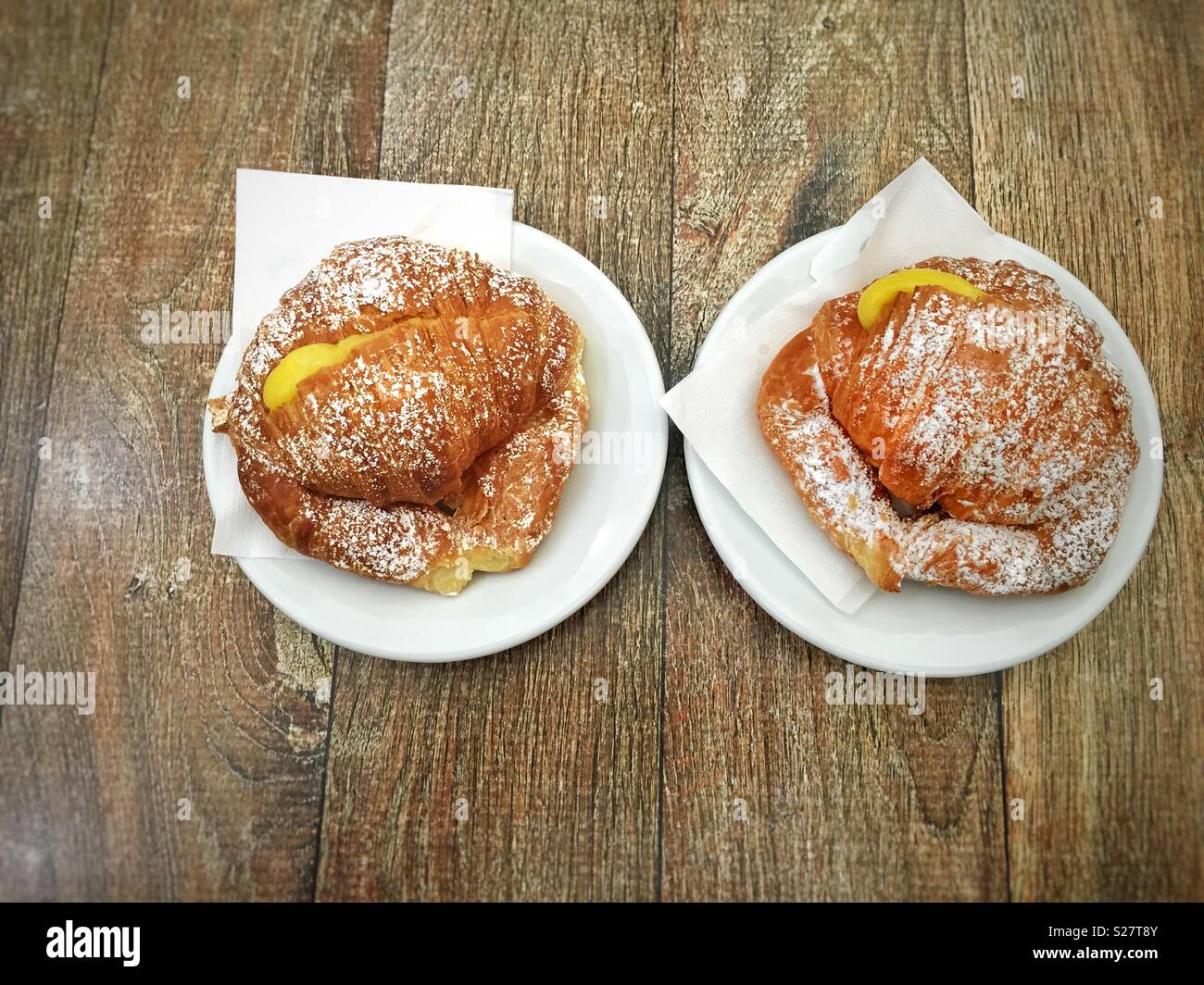 Two fresh croissants stuffed with cream - Smartphone Captured Stock Image