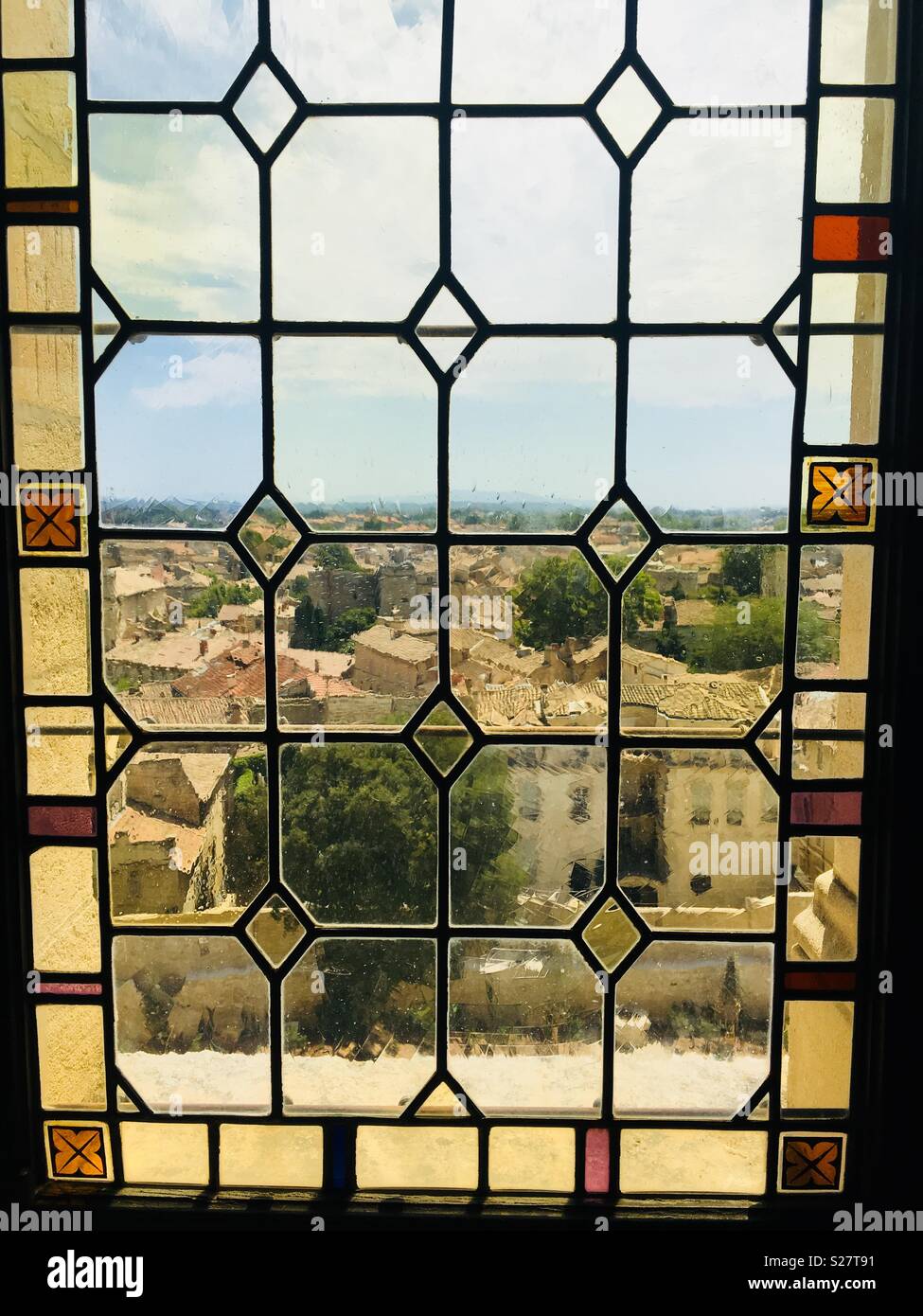 Beautiful stain-glass window view of the city below. Stock Photo