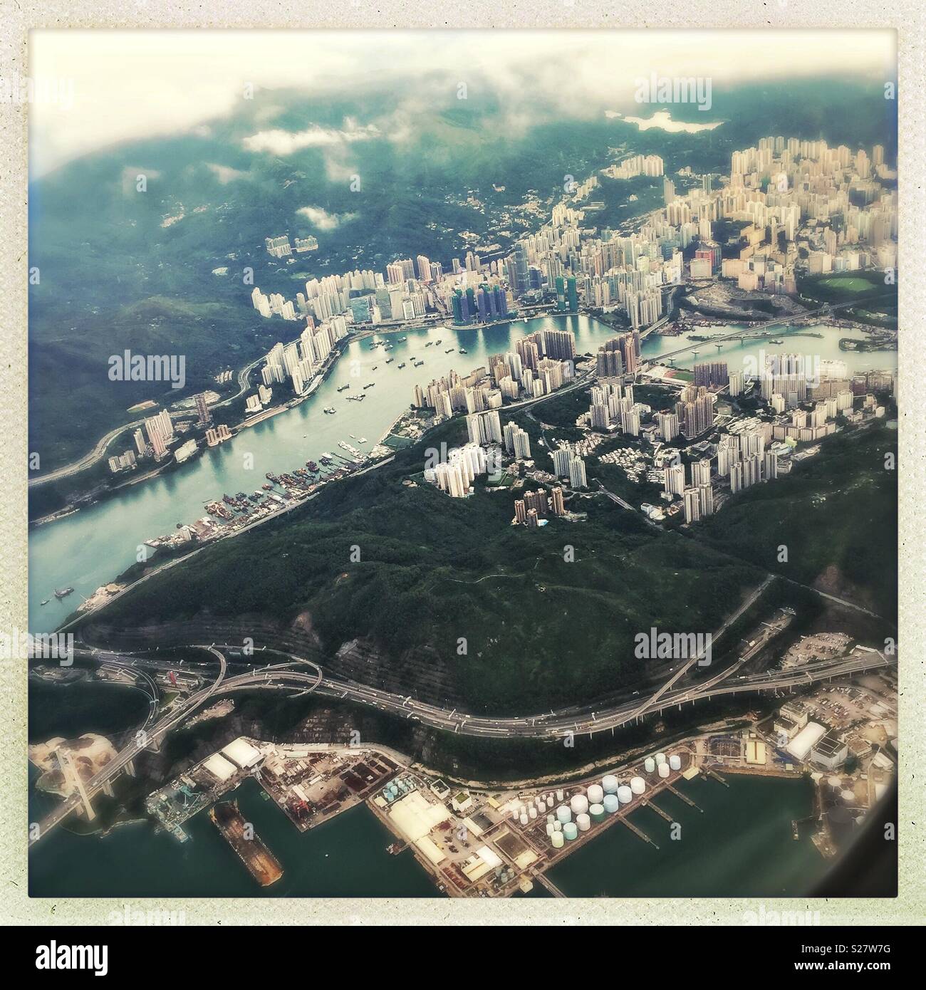Tsing Yi Island, Rambler Channel and Tsuen Wan in Kowloon viewed from a passenger jet departing Hong Kong - Smartphone Captured Stock Image