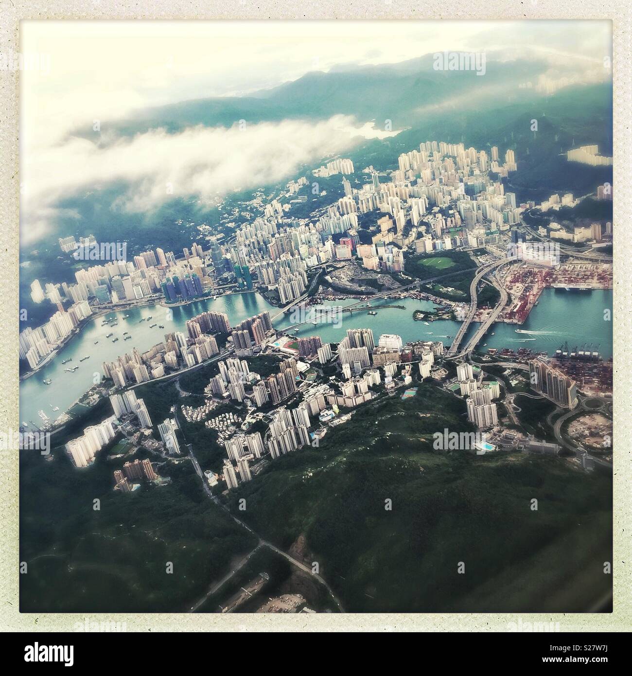 Tsing Yi Island, Rambler Channel and Tsuen Wan in Kowloon viewed from a passenger jet departing Hong Kong - Smartphone Captured Stock Image
