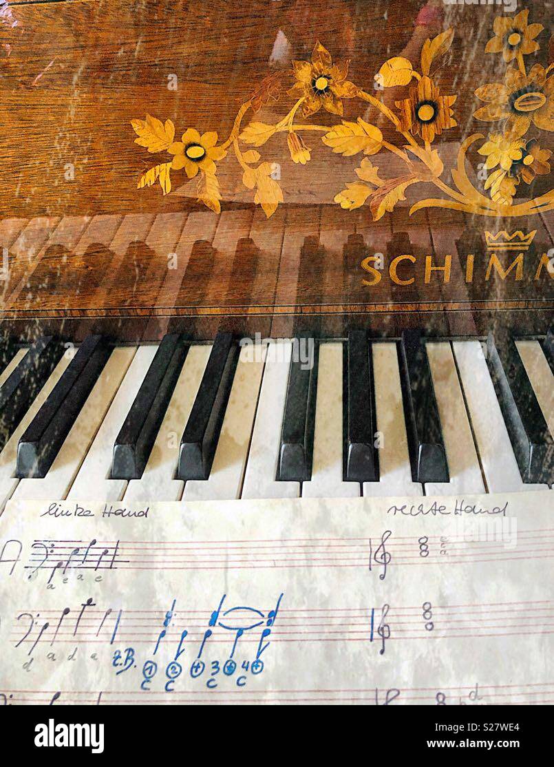 Old  venerable piano and young music notes. - Smartphone Captured Stock Image