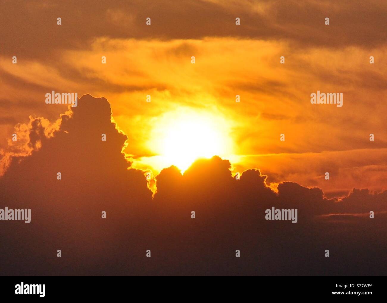 Sun bursting through the clouds hires stock photography and images Alamy