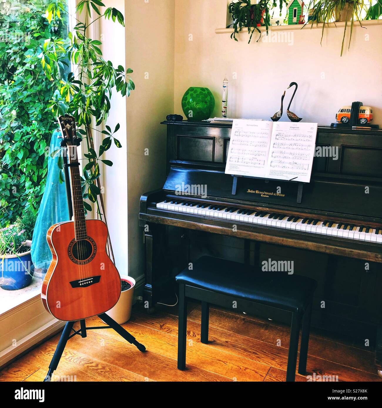 Piano and guitar - music room Stock Photo