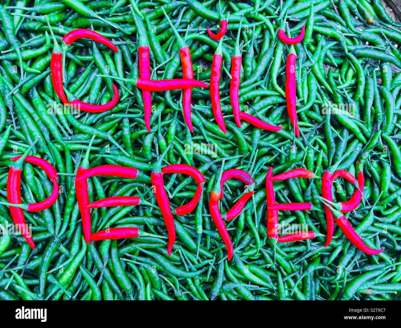 Chili pepper spelled out in chili peppers Stock Photo