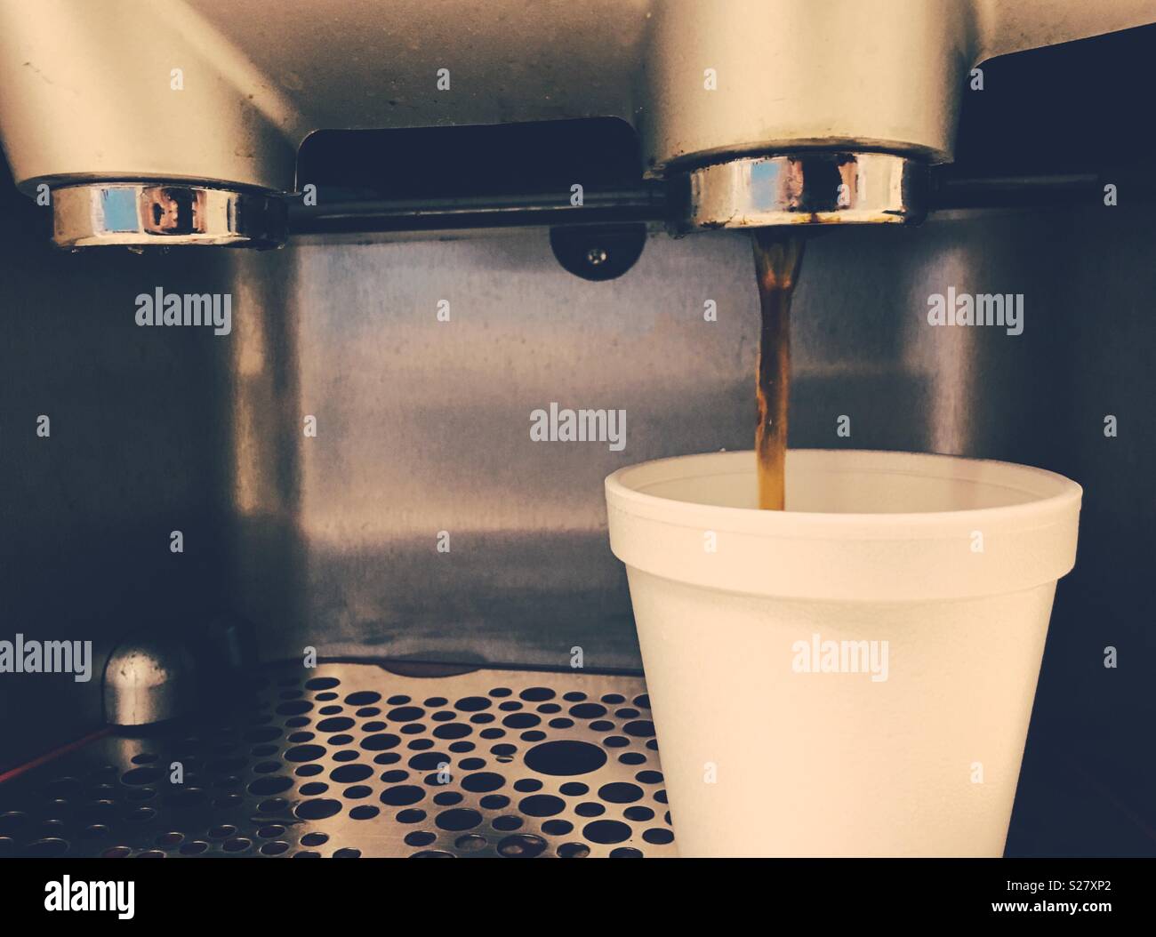 Espresso machine pouring a cup of coffee. Stock Photo