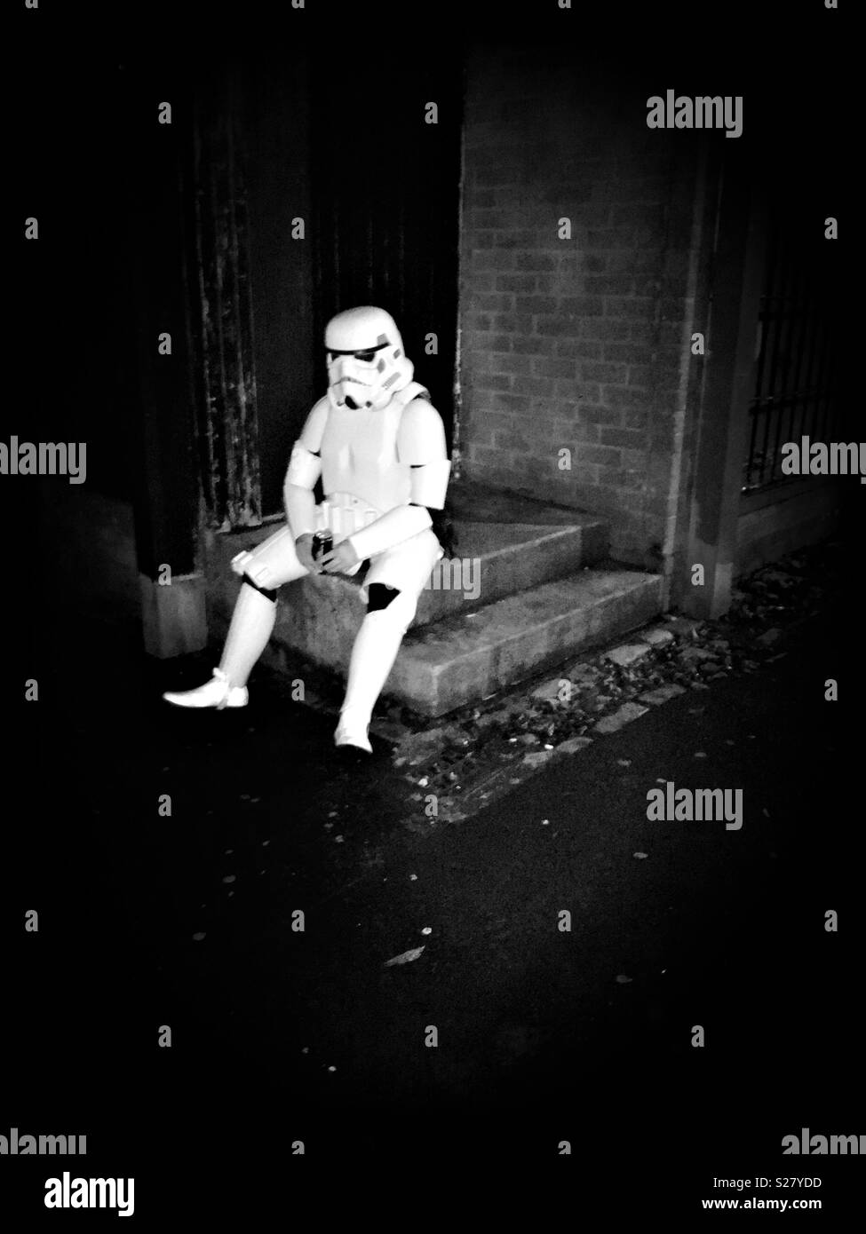 Stormtrooper sitting on step holding a drink - Smartphone Captured Stock Image