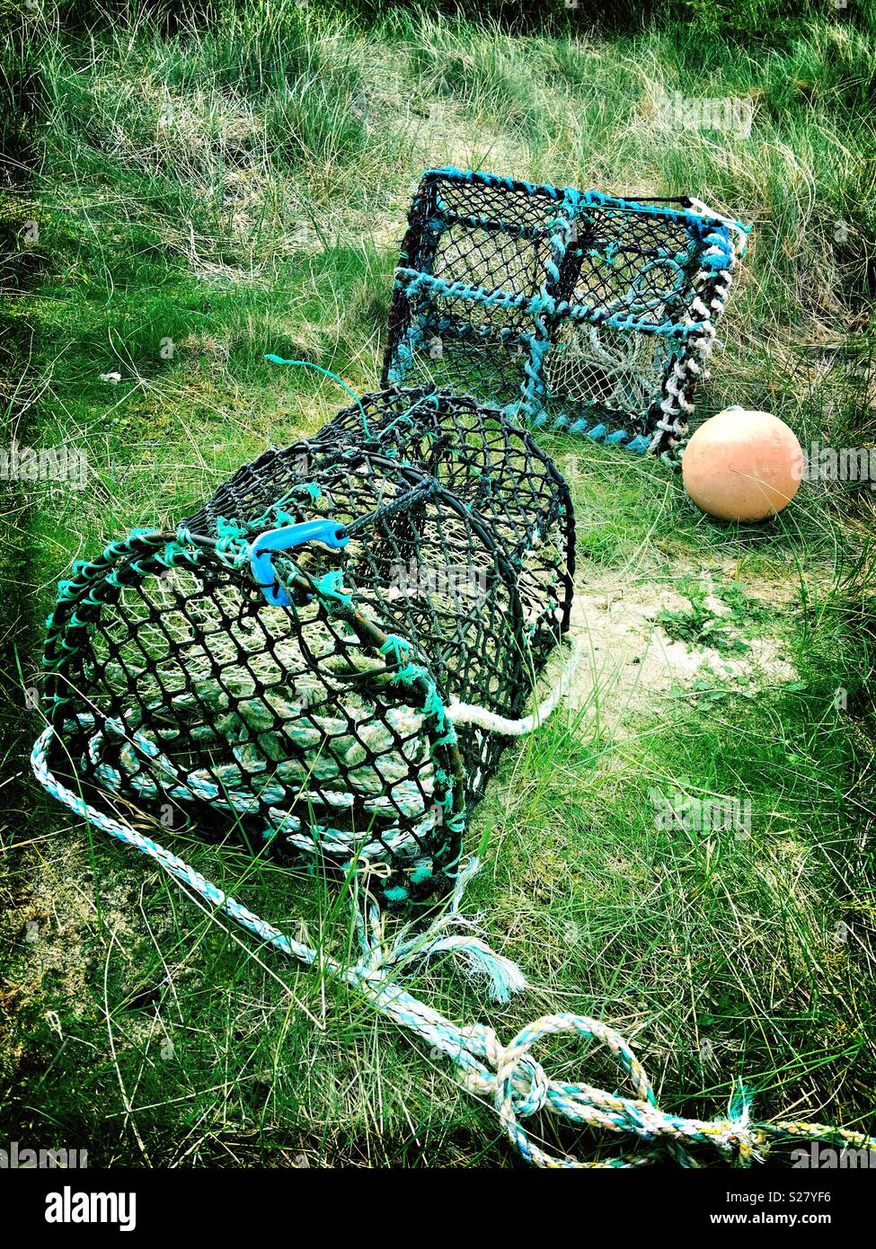 Lobster Pots and Float on Sandy Grass Stock Photo Alamy