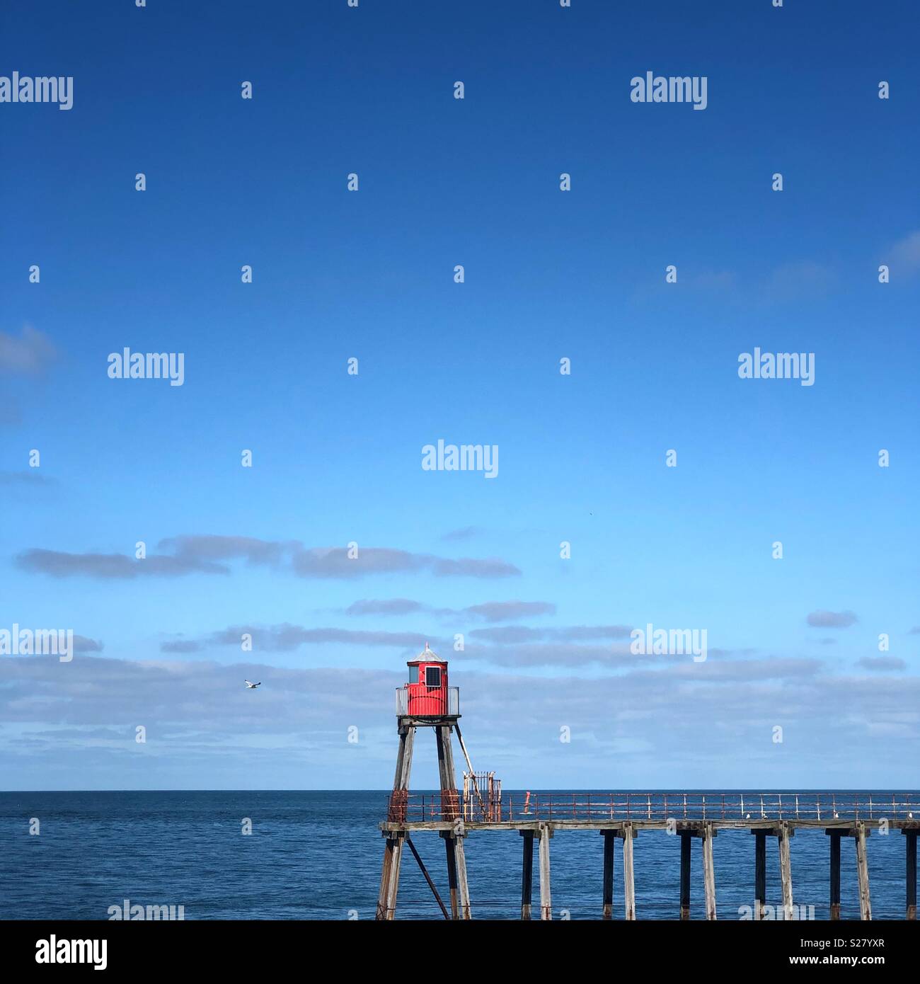 Red light at the harbour entrance. - Smartphone Captured Stock Image