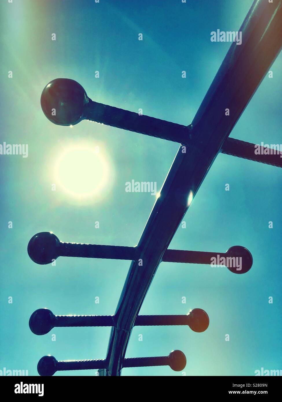 The jungle gym challenges you to exercise your muscles, strength and endurance under the Summer sun Stock Photo