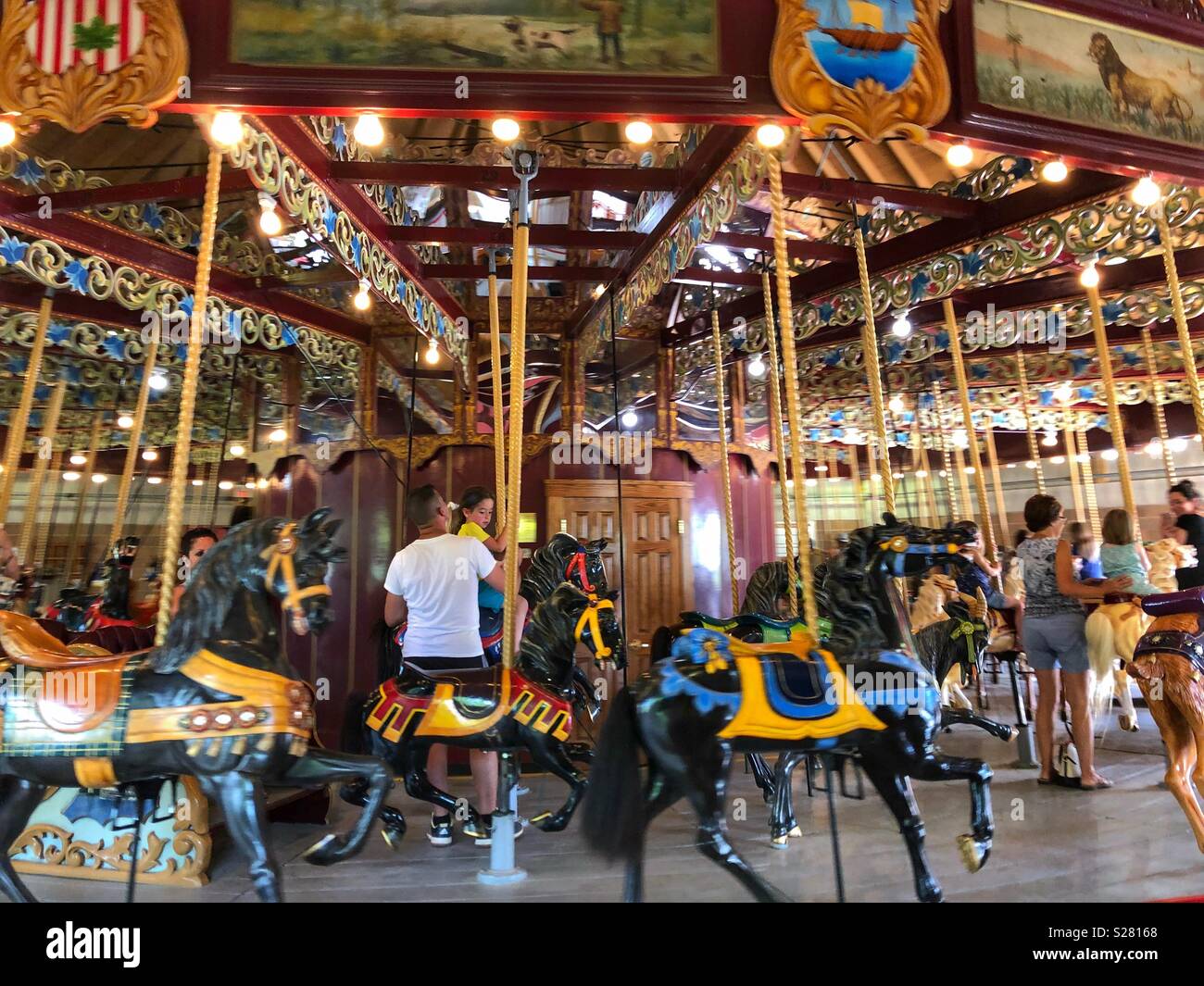 Vintage carousel in motion. - Smartphone Captured Stock Image