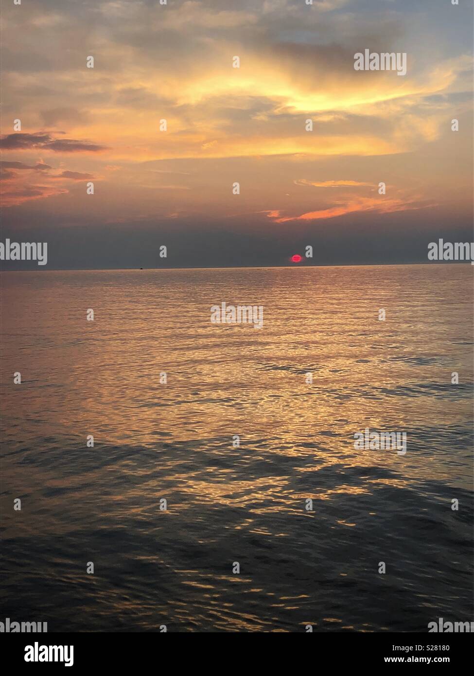 Red ball of fire, beautiful sunset. - Smartphone Captured Stock Image