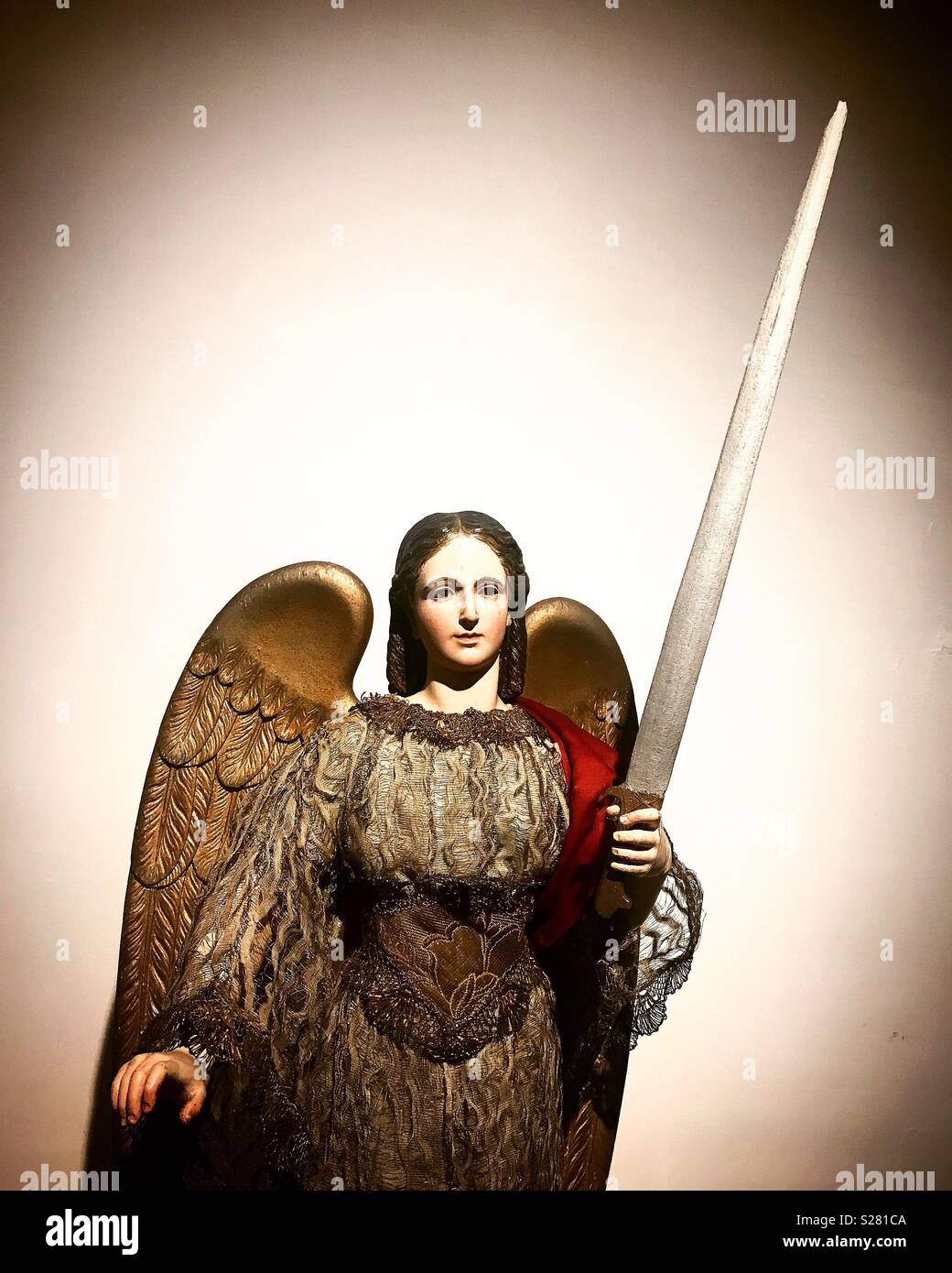 A sculpture of Saint Michael Archangel is displayed in the museum of the Basilica of Our Lady of Guadalupe in Mexico City, Mexico - Smartphone Captured Stock Image