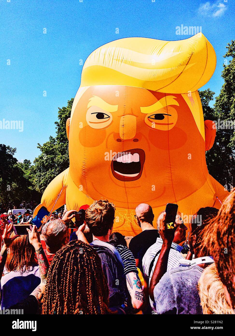 Protestors surrounding Donald Trump inflatable baby blimp during protests against his Uk visit, Parliament Square, London Stock Photo
