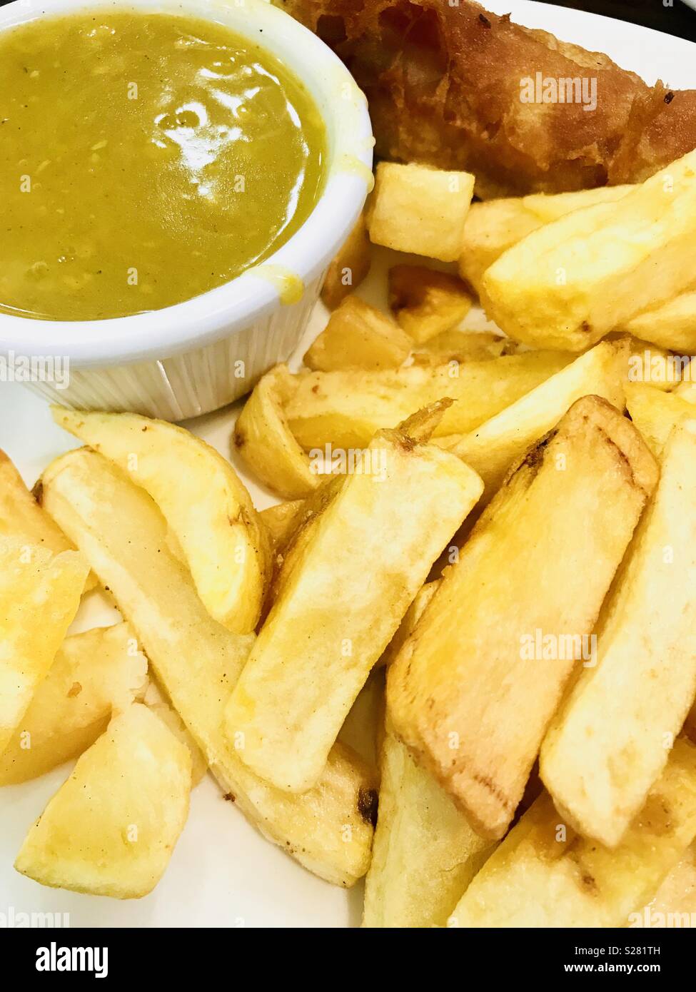 Fish, chips and curry sauce Stock Photo Alamy