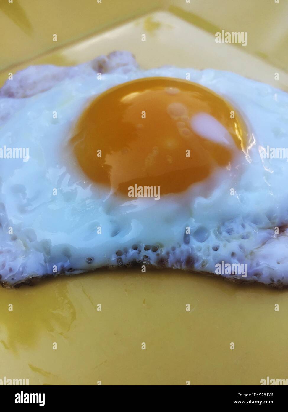 Closeup of one fried egg - Smartphone Captured Stock Image
