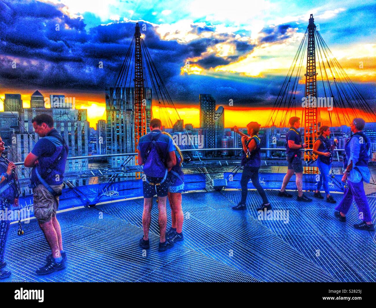 Climbers at top of the O2 (Millenium Dome) roof walk, O2 arena, Greenwich, London Stock Photo