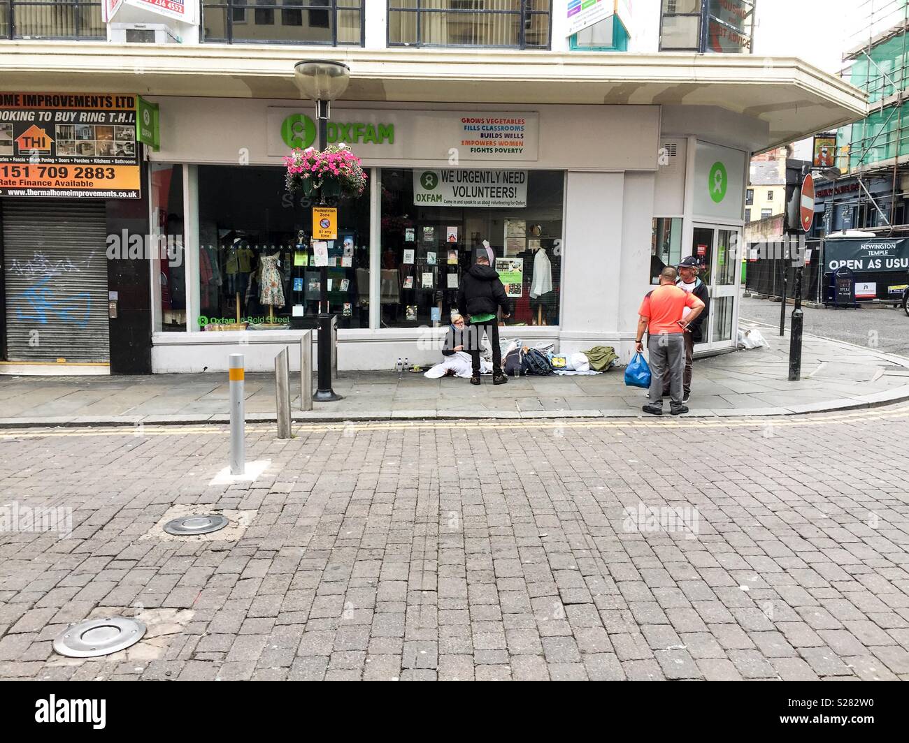 Rough sleepers outside Oxfam shop in Liverpool Stock Photo Alamy