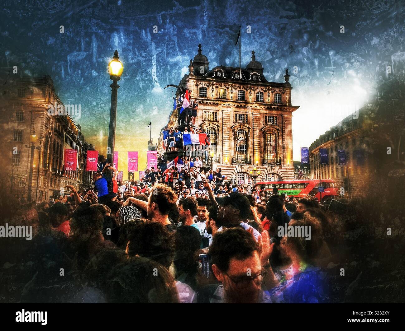 French fans celebrating France’s 2018 World Cup win, Eros statue, Piccadilly Circus, London - Smartphone Captured Stock Image