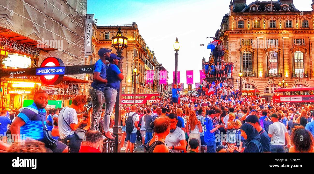 French football fans celebrating France’s 2018 World Cup win, Piccadilly Circus, London - Smartphone Captured Stock Image