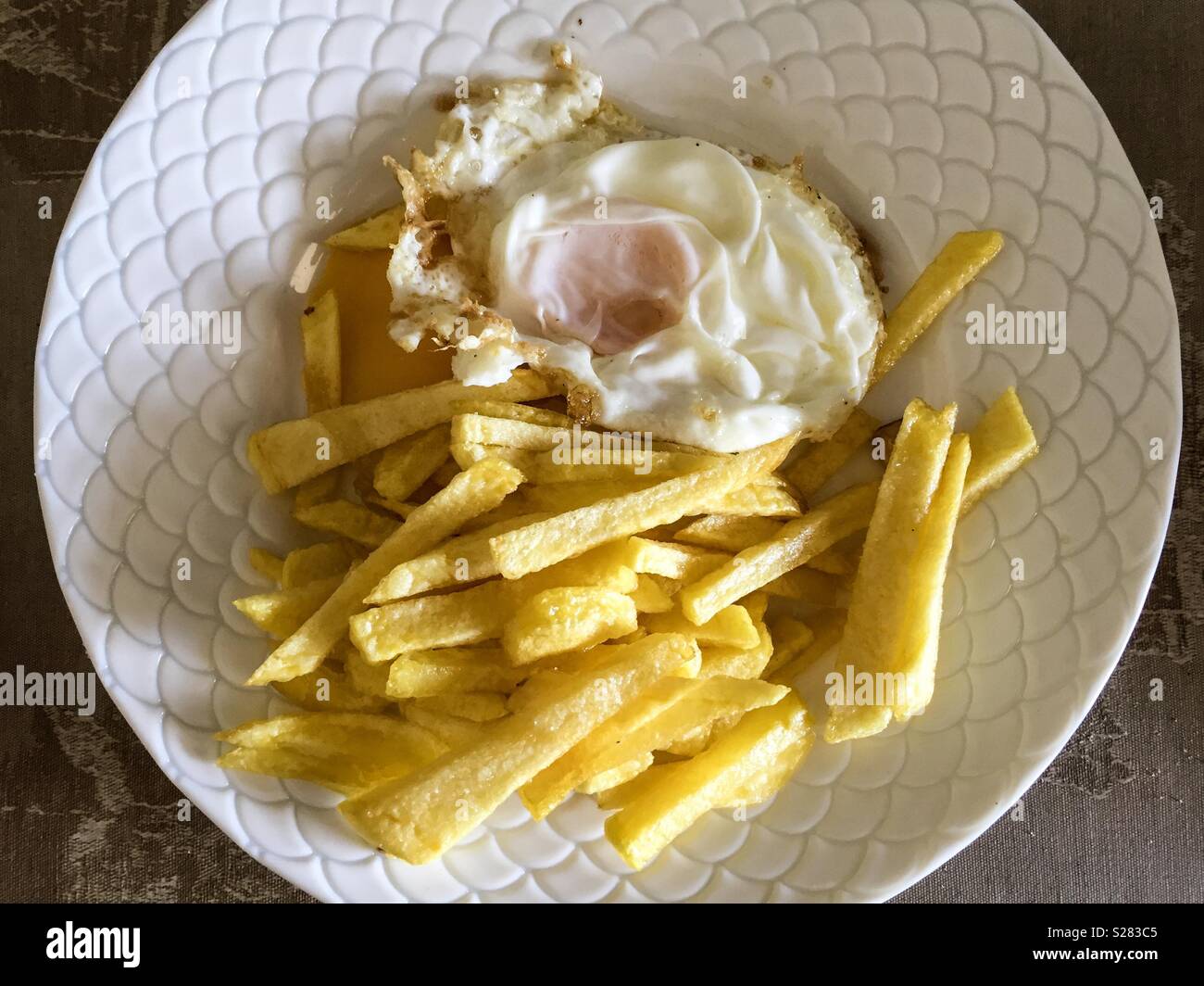 fried egg with chips - Smartphone Captured Stock Image