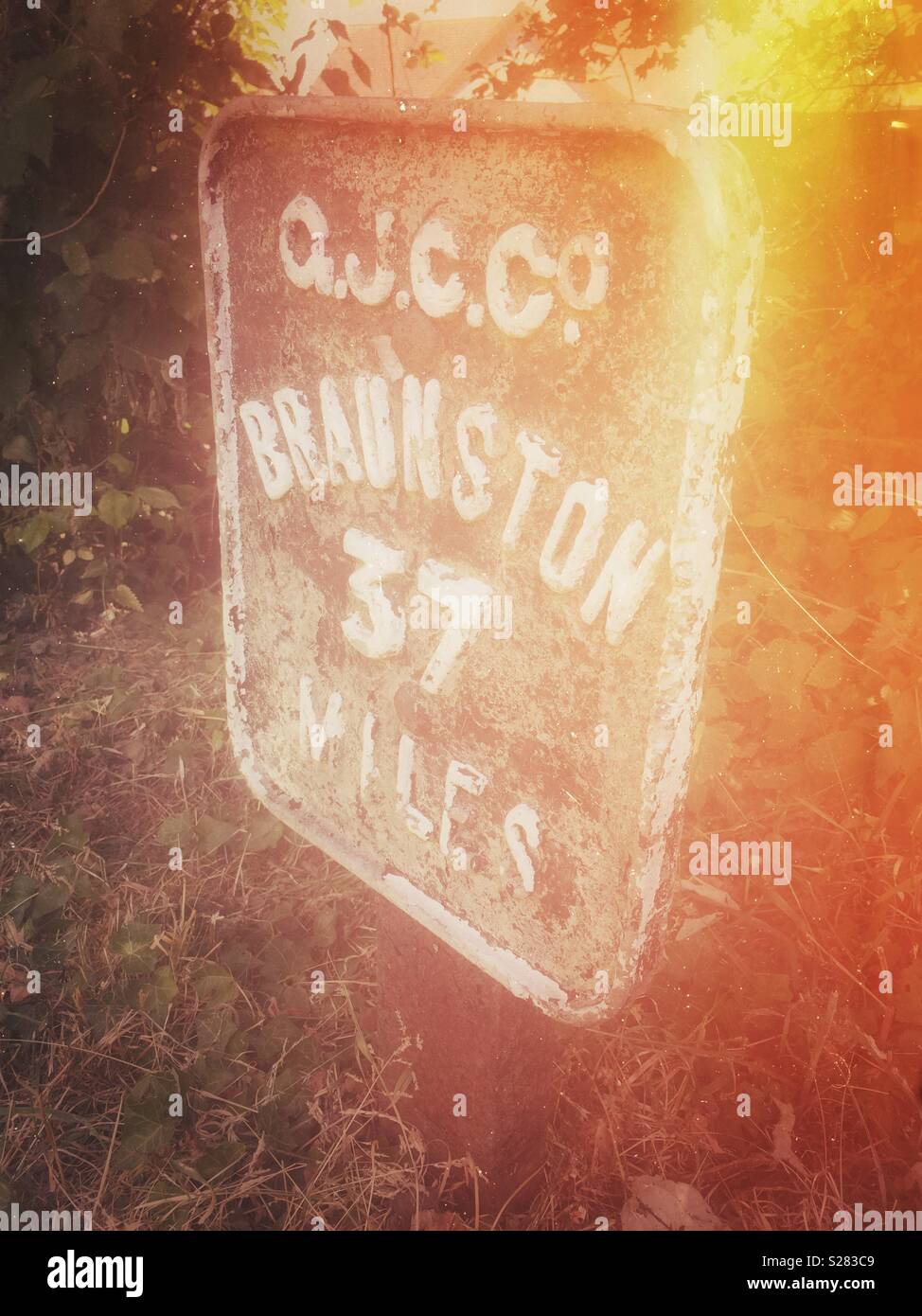 Milestone on the Grand Union Canal in Simpson, Milton Keynes, indicating 37 miles to Braunston - an important marina on the Grand Union Canal - Smartphone Captured Stock Image