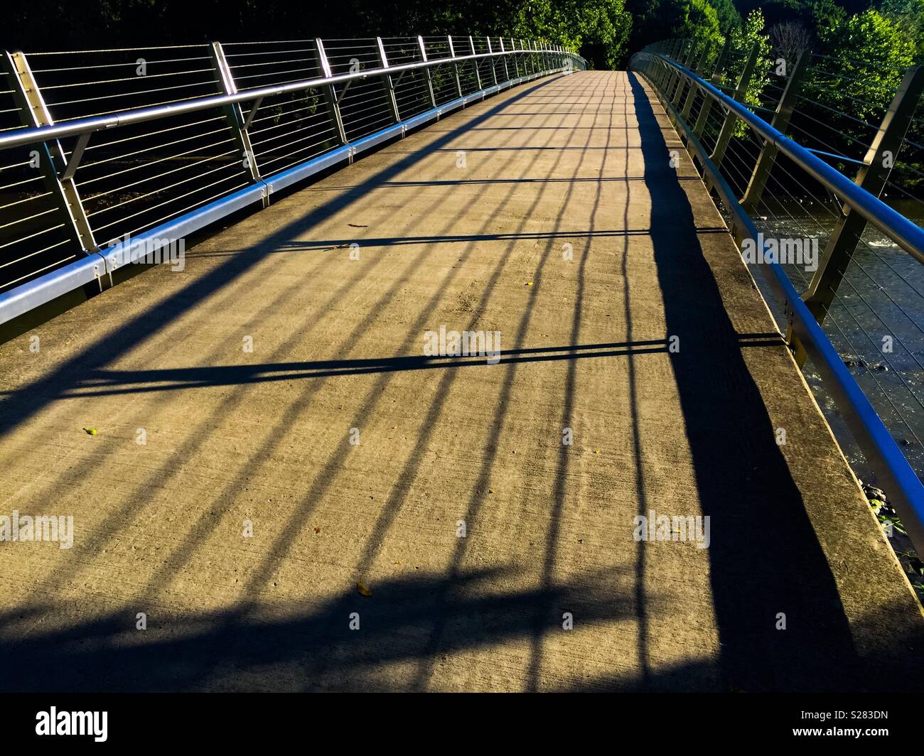 Low, modern design bridge in a park - Smartphone Captured Stock Image Low, modern design bridge in a park - Smartphone Captured Stock Image