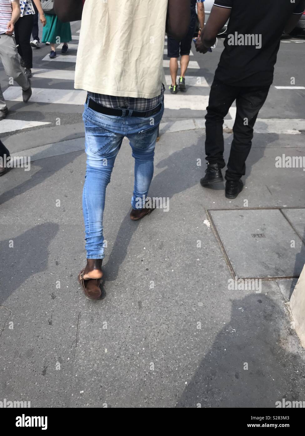 The almost falling jeans, worn by a man walking on streets of Paris, France  Stock Photo - Alamy