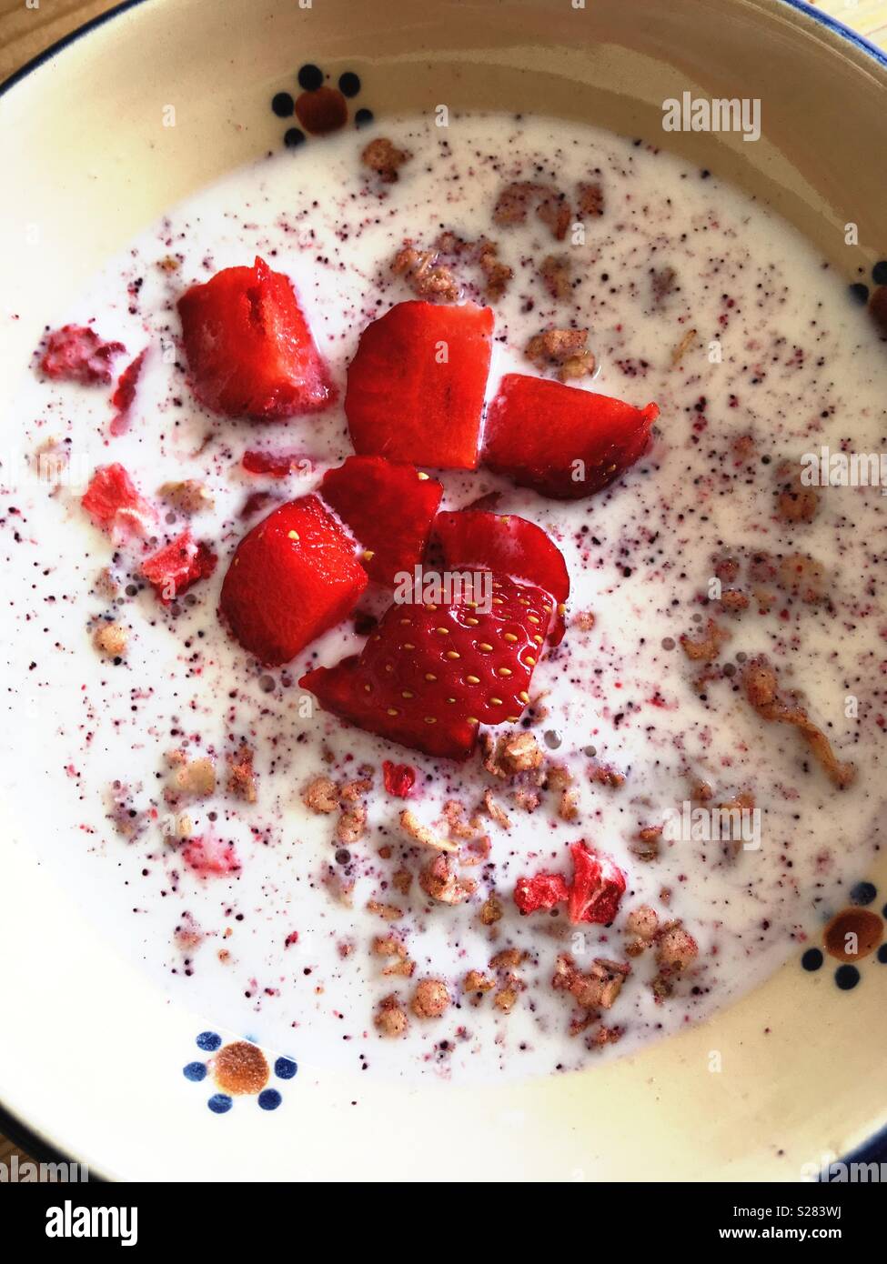 Strawberries in milk with cereals Stock Photo