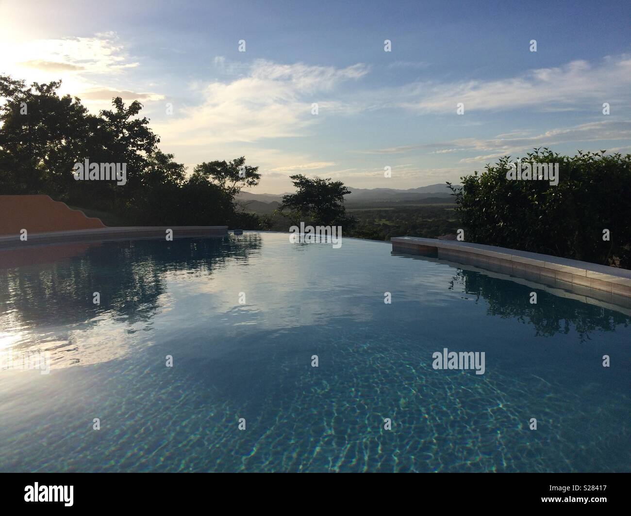 Landscape View Across Hillside Swimming Pool in Costa Rica - Smartphone Captured Stock Image