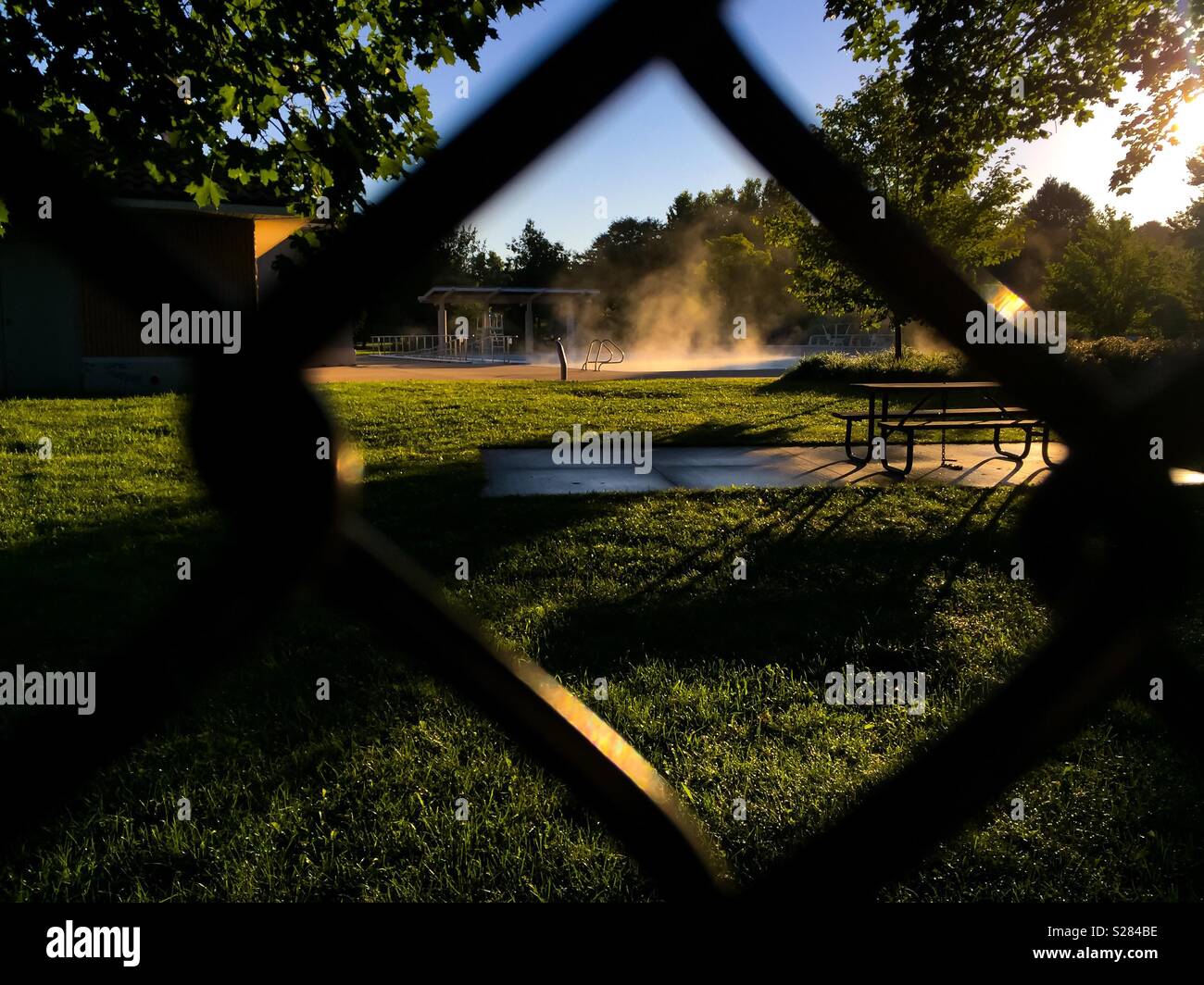 Steam rising on an outdoor swimming pool - Smartphone Captured Stock Image