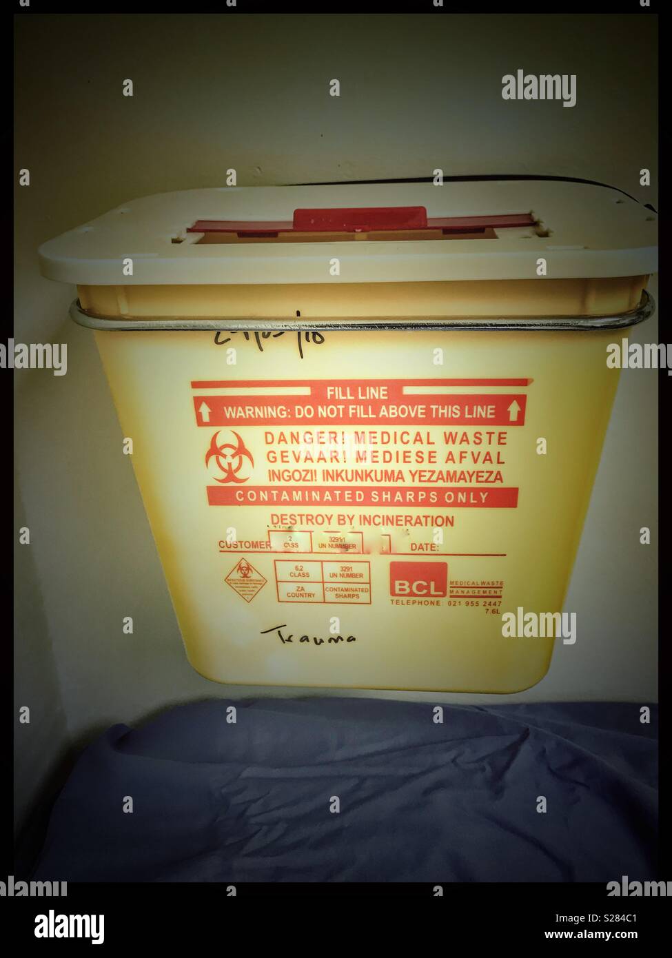 Used sharps container for medical waste in emergency room of hospital