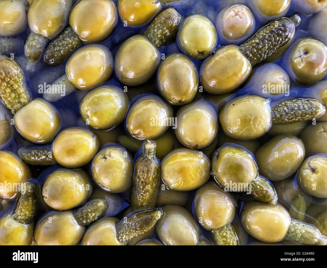 Olives stuffed with gherkins for sale on a market stall in Spain Stock Photo