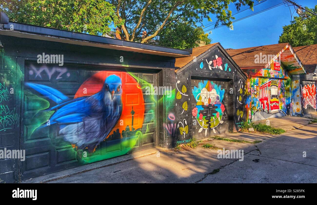 A row of painted alley garages in a Toronto neighbourhood. - Smartphone Captured Stock Image