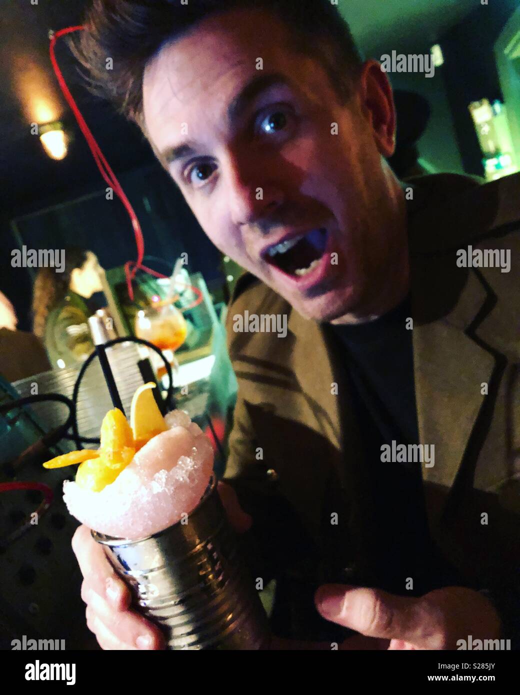 Man with cocktail in a can - Smartphone Captured Stock Image