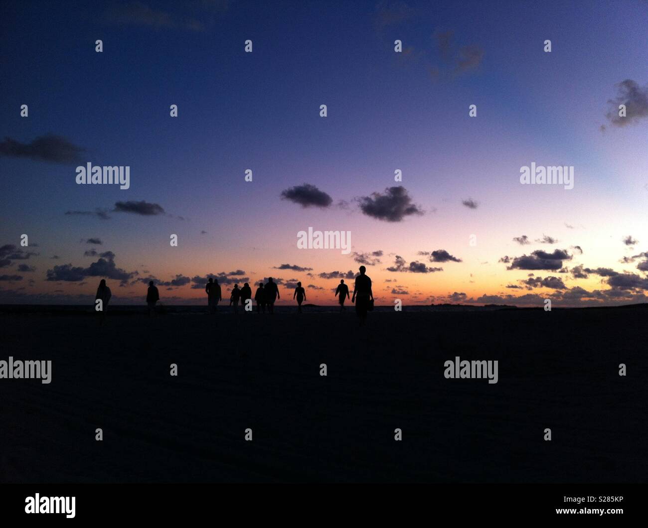 Walking meditation group - sunrise Bahamas Stock Photo