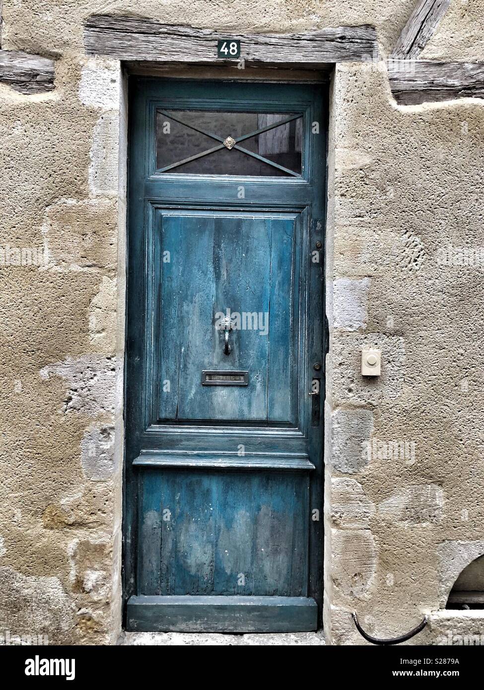 Blue, painted door in a French town - Smartphone Captured Stock Image