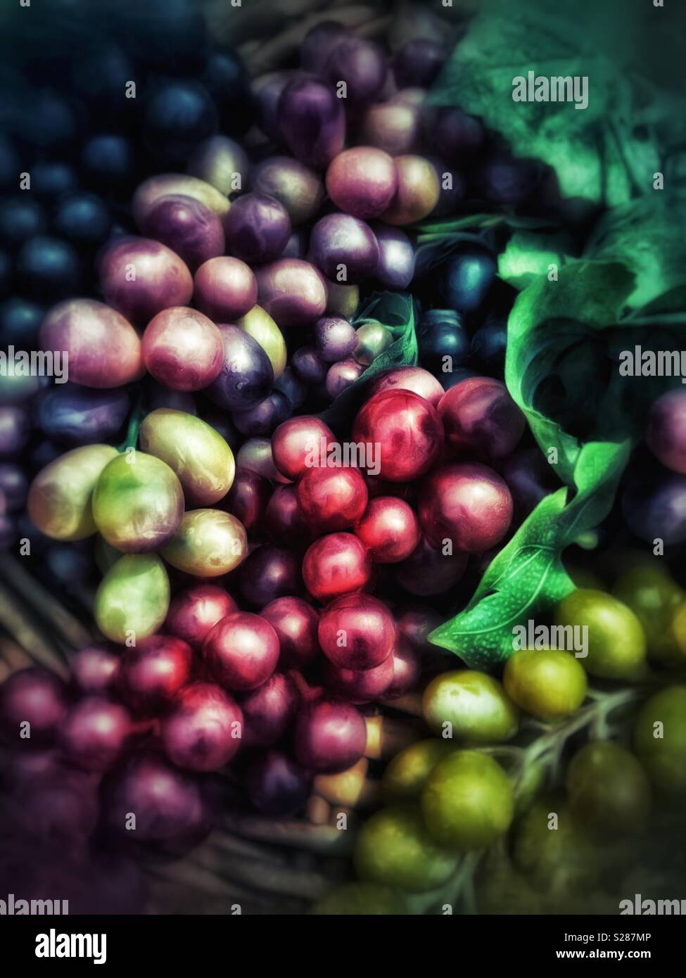 Basket of colorful artificial grapes - Smartphone Captured Stock Image