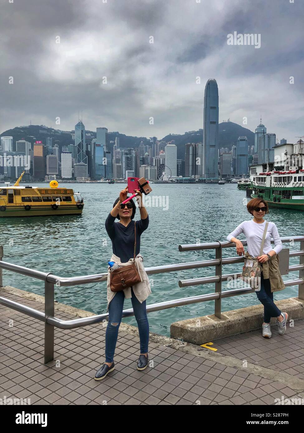 Taking selfies at Victoria Harbour in Hong Kong Stock Photo - Alamy