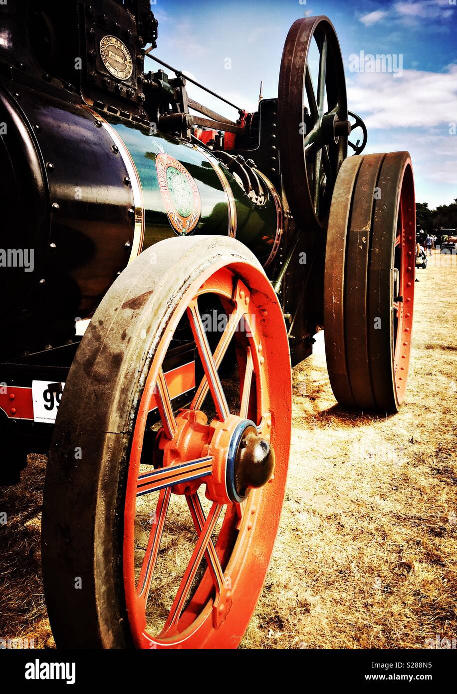 Black steam tractor with red wheels Stock Photo