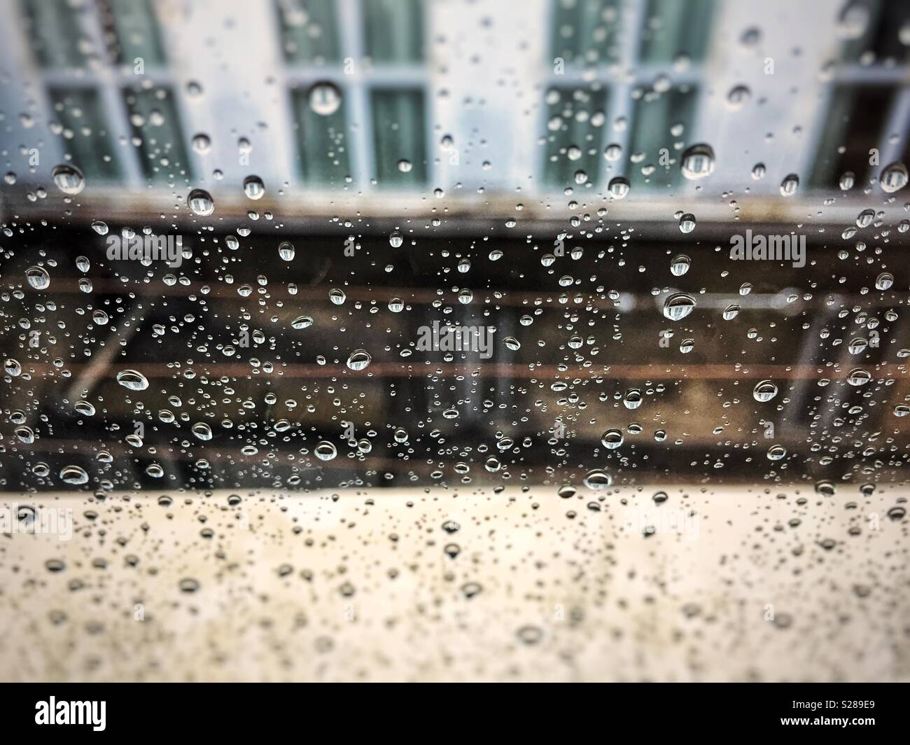 Raindrops on a window glass - Smartphone Captured Stock Image