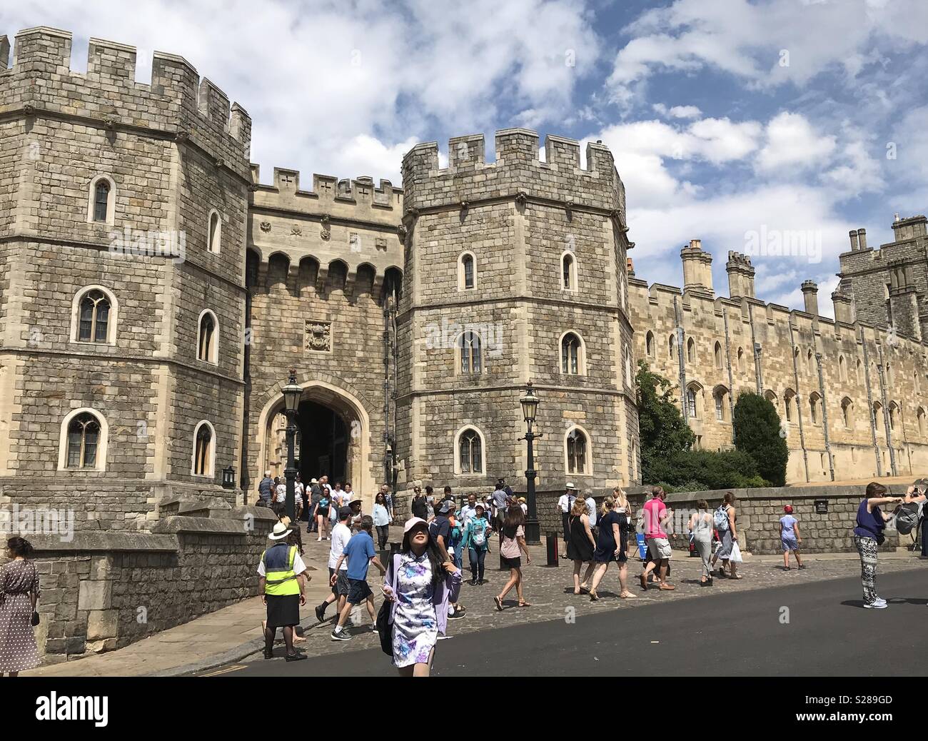 People outside Windsor Castle, England - the oldest and largest inhabited castle in the world. - Smartphone Captured Stock Image