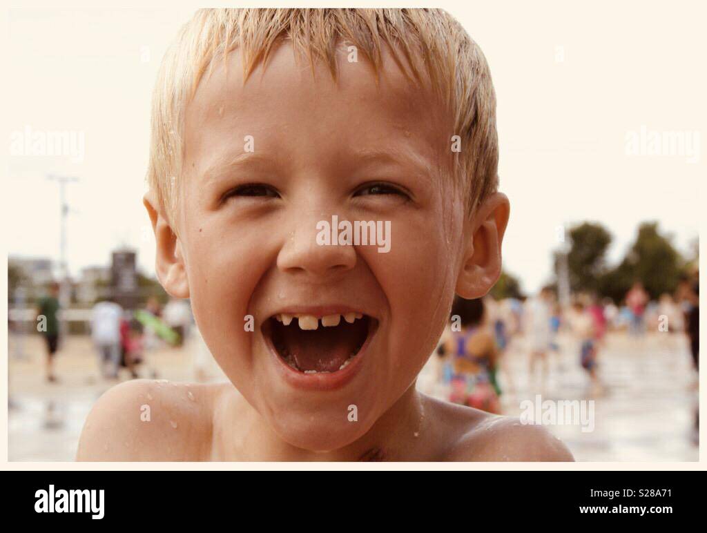 Close up of young boy smiling with missing teeth Stock Photo