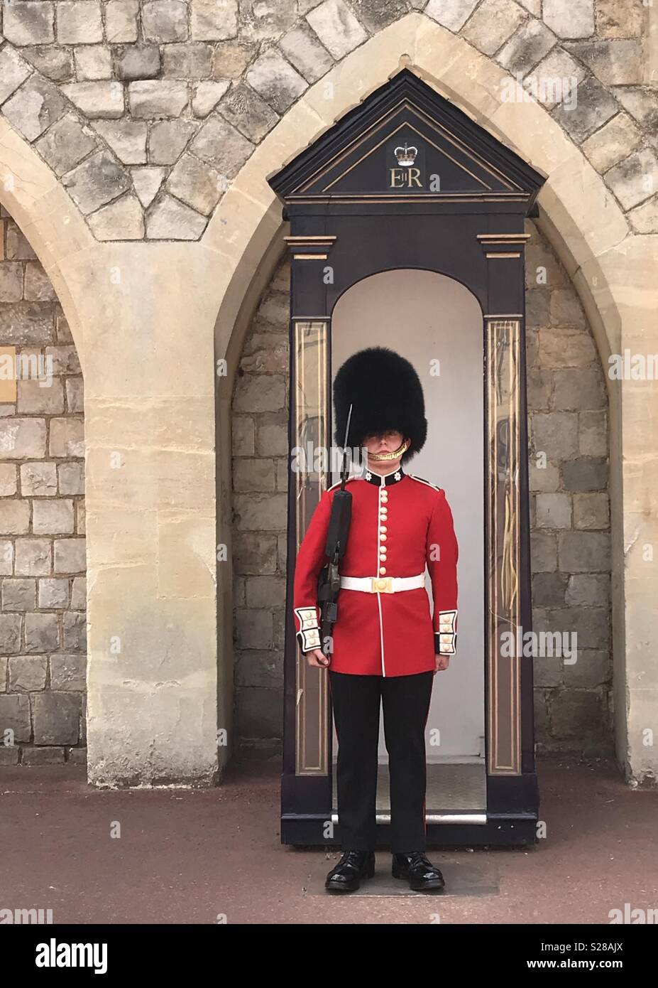 One of the Queen’s guards at Windsor Castle, England Stock Photo