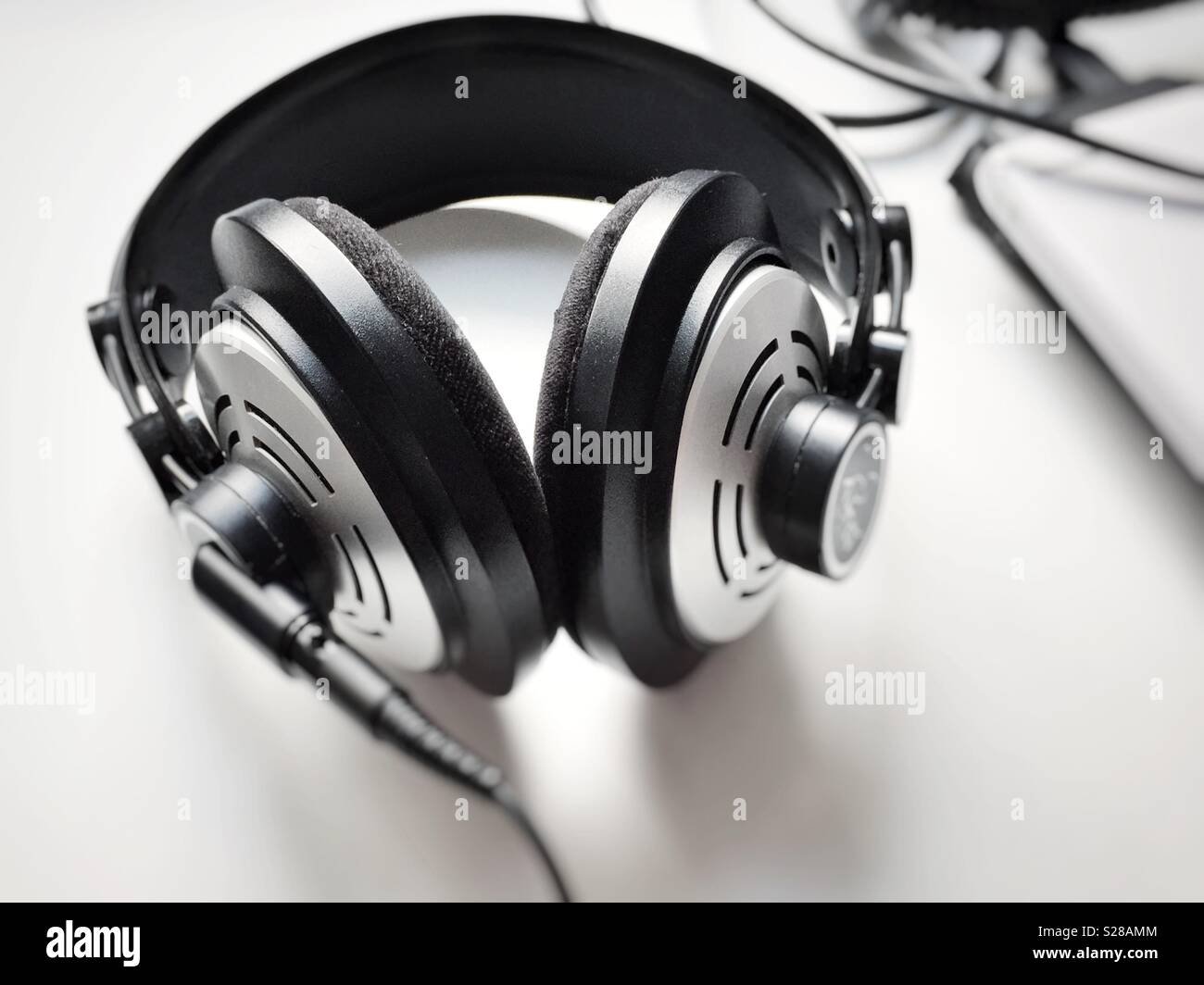 Black and white professional headphones. Selective focus. Music and relaxation concept - Smartphone Captured Stock Image